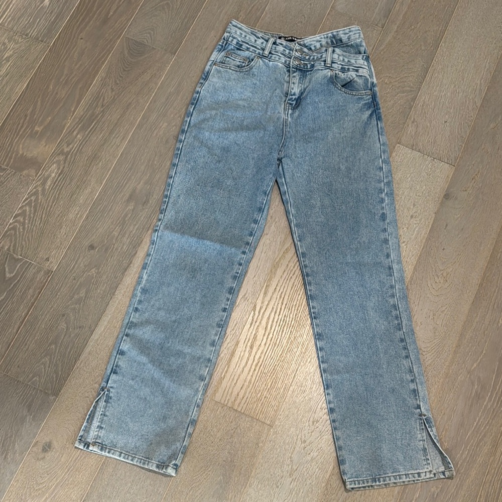The Kript Classic Blue Denim Jeans with cross buttons.
